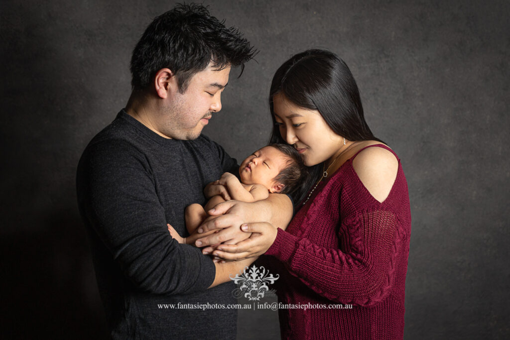 Mum and dad holding the baby - Newborn and Family Portrait Wedding Photography, Newborn and Family Portrait | Fantasie Photography